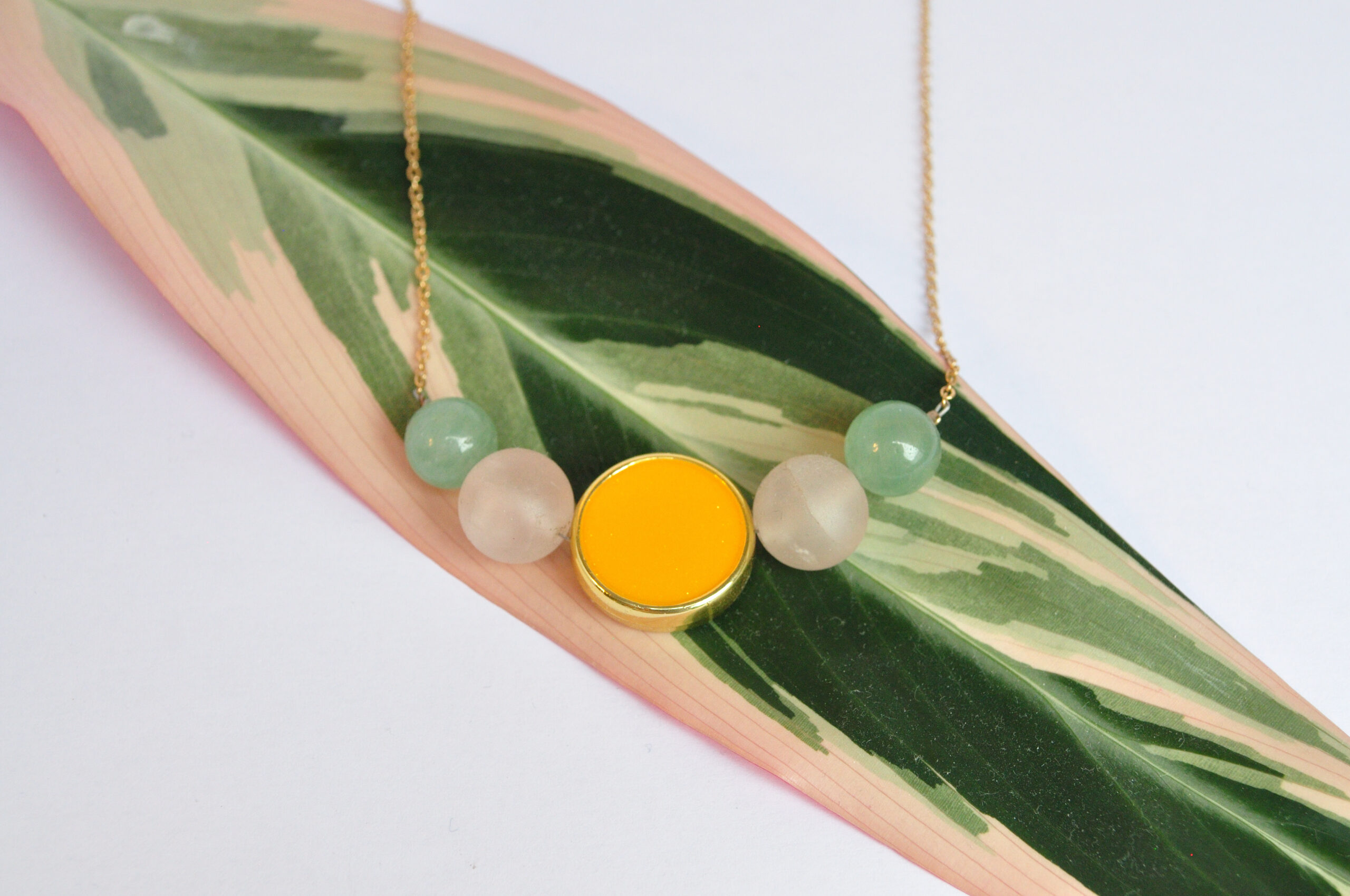 super fine gold-plated cable chain necklace with symmetric composition of rosequartz, jade beads and acrylic yellow sparkling flat round bead with golden rim