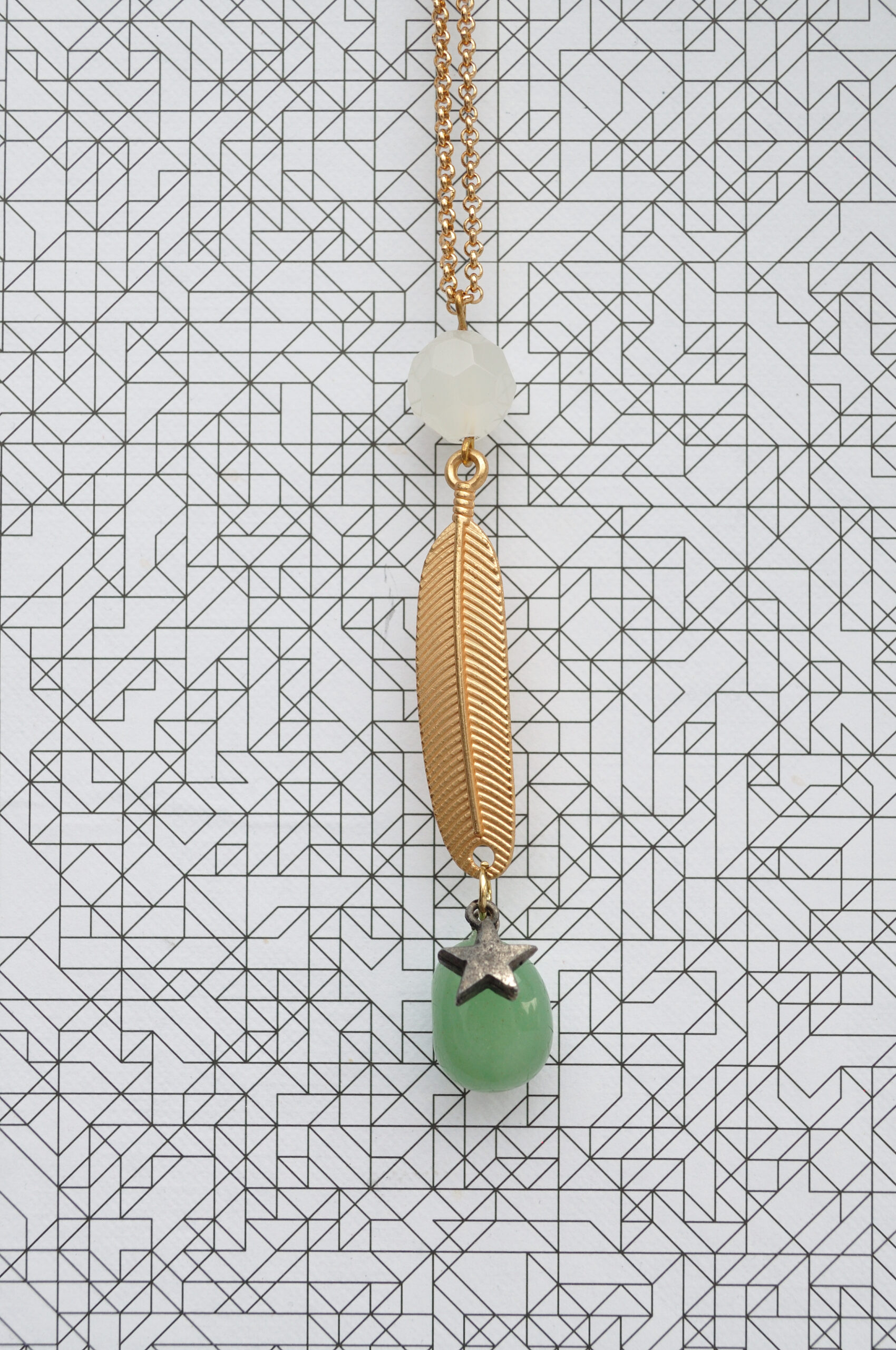 fine golden cable chain necklace with glass elements in white and mint, long feather and silver colour star pendant