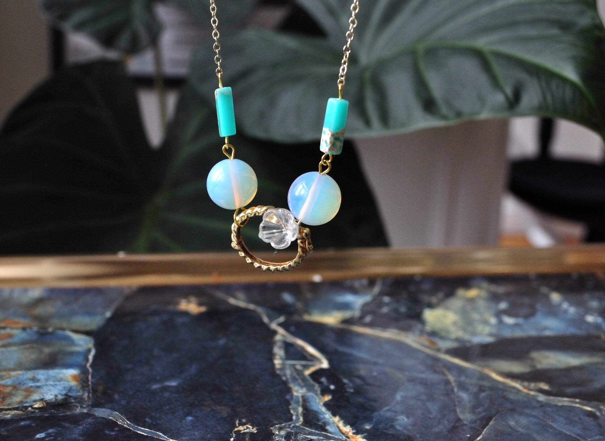 fine, gold-plated Art Deco style necklace with crackled mint coloured resin tubes, round Opalite beads, glass flower and vintage necklace binder